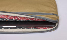 Load image into Gallery viewer, Protective foam sits between the layers of sturdy canvas fabric and beautiful black and red patterned lining of the 13 inch laptop case in Sand. 
