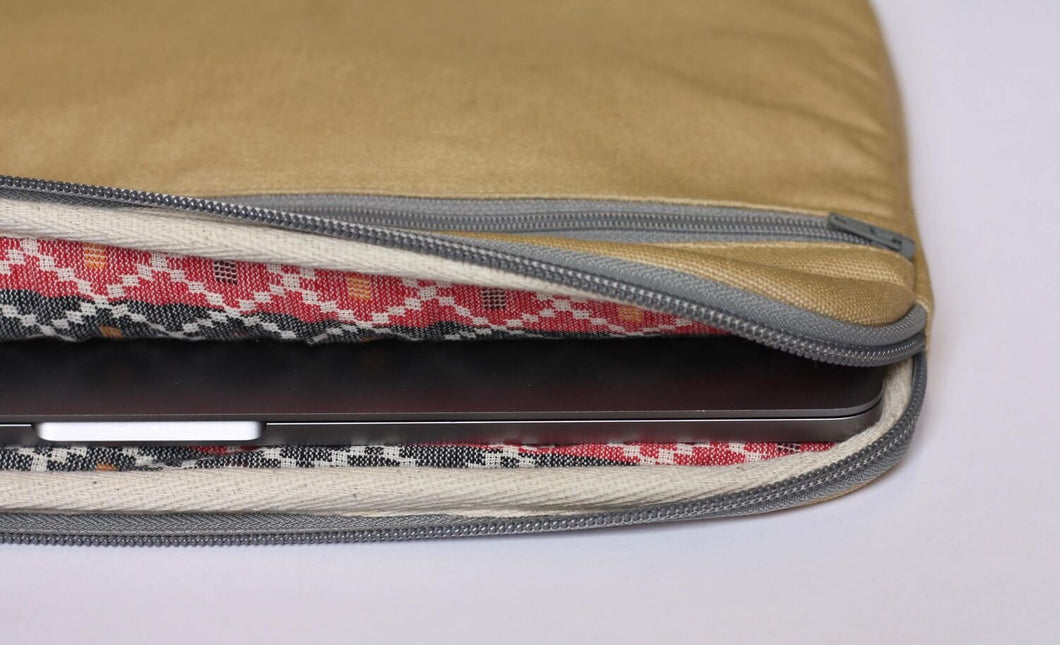 Inside the 15 inch laptop case showing the black and red traditional lining that is sourced locally to our ethical production partner in Kathmandu.